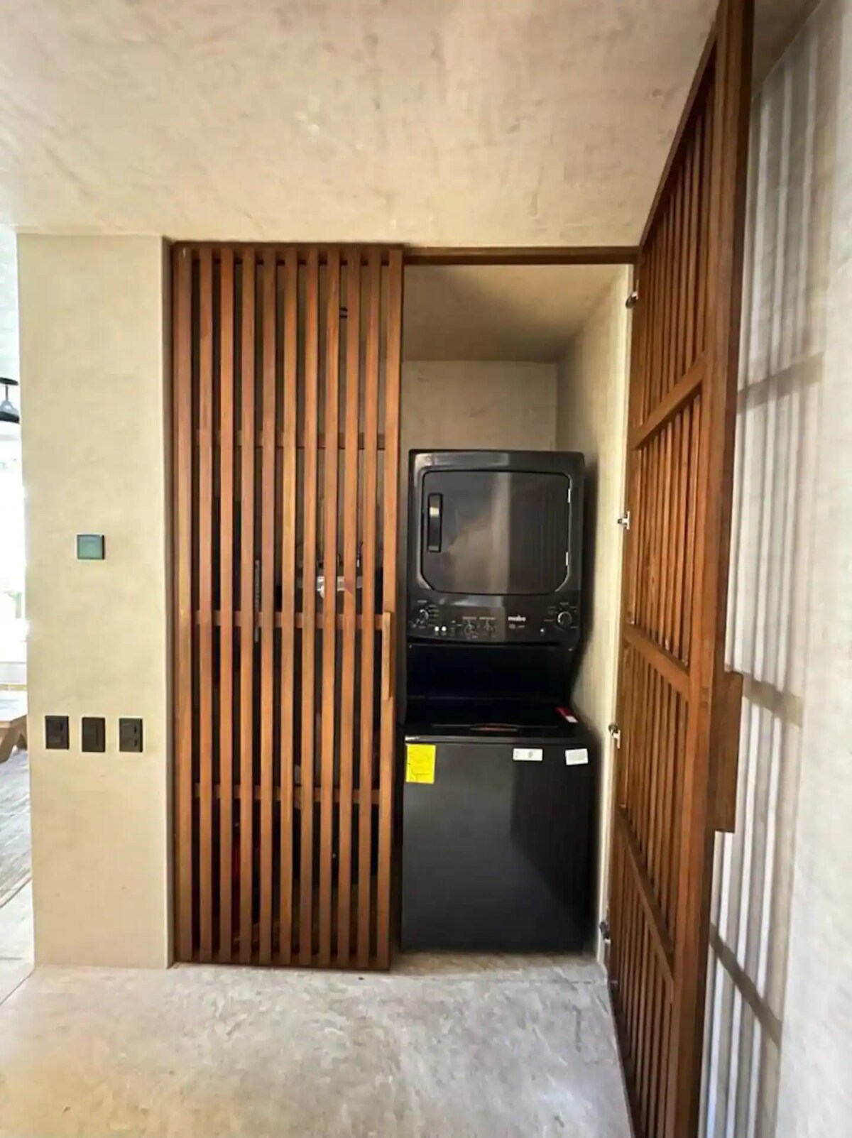 Outdoor dining area surrounded by tropical plants
