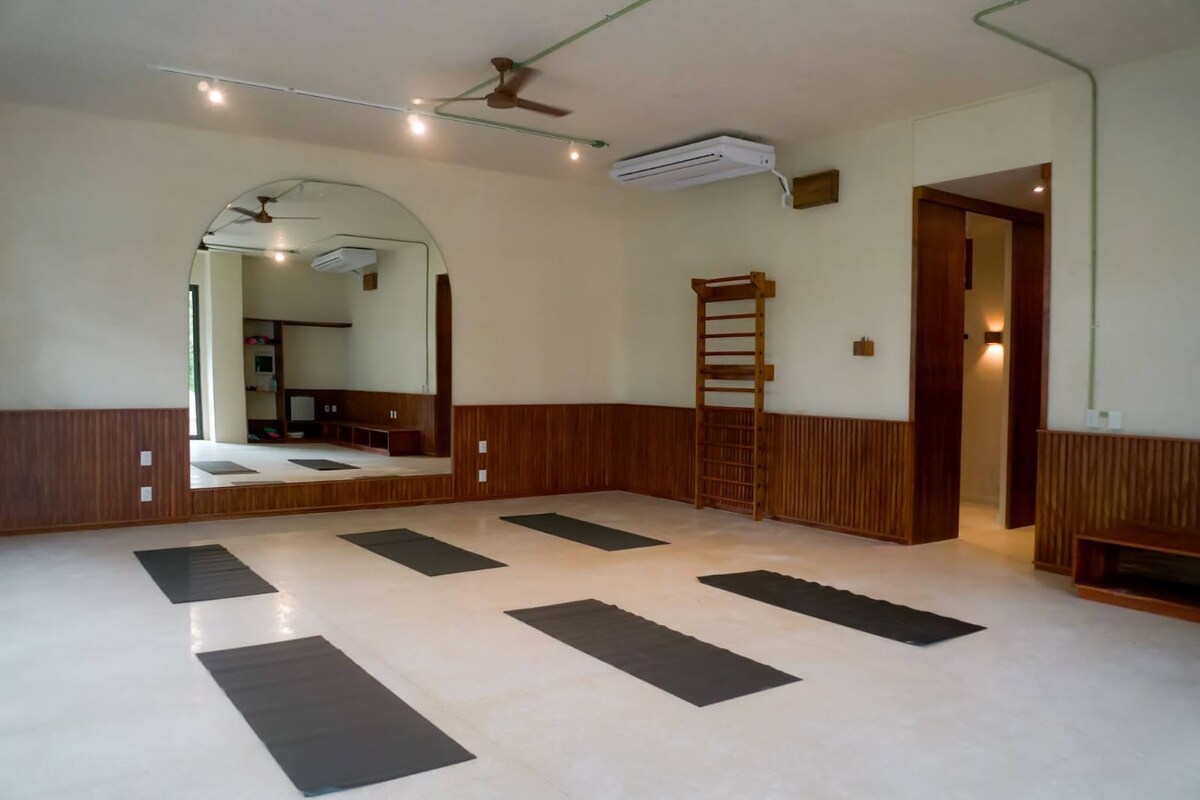 Pool loungers with shade umbrellas at private pool
