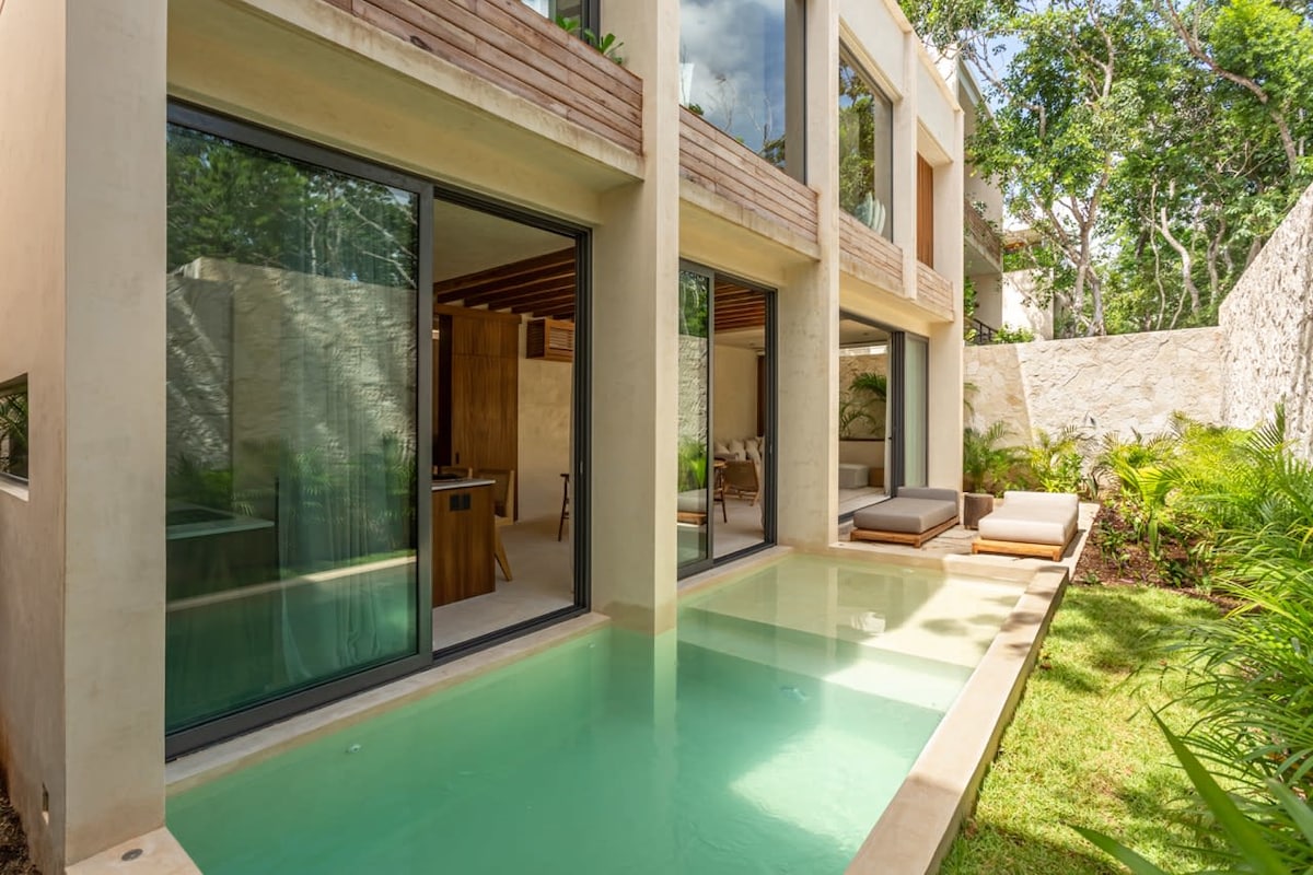 Luxury Jungle VIBE villa exterior with private pool and tropical jungle surroundings in Tulum Mexico